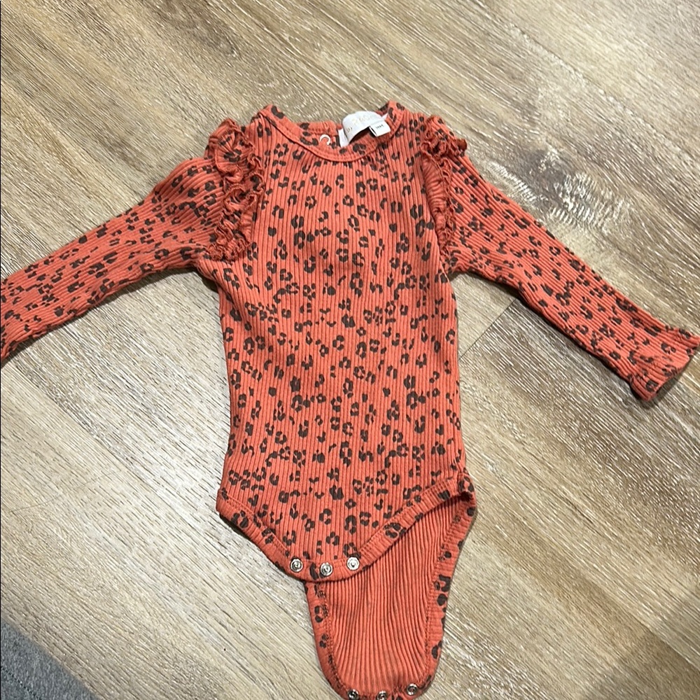 Rachel Orange and Black Floral Bodysuit with Ruffle Detail